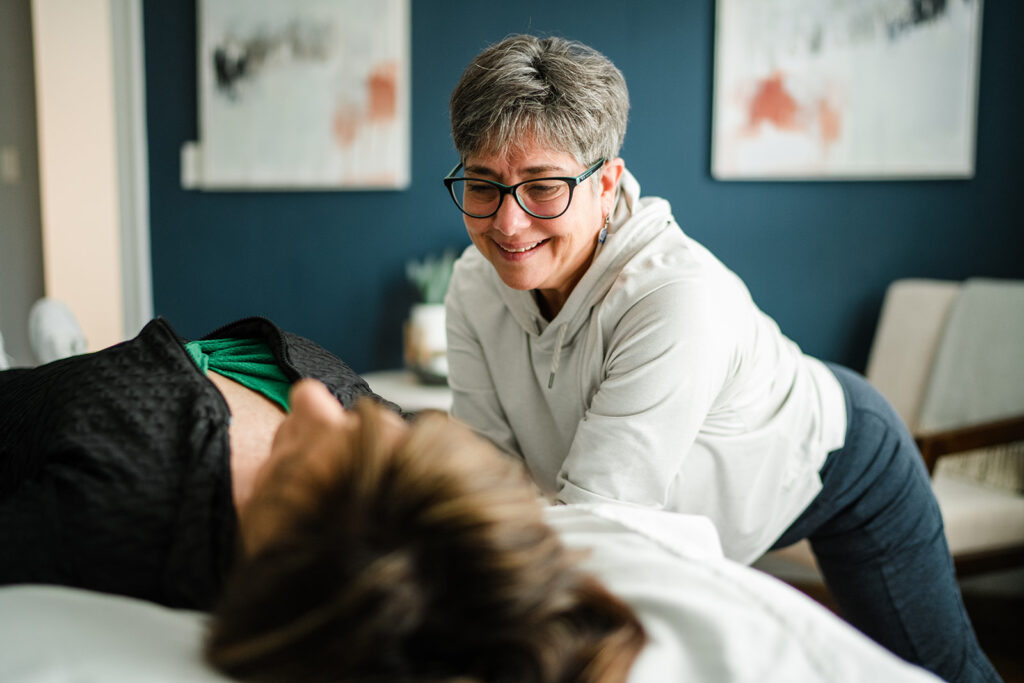 physical therapist working on a woman