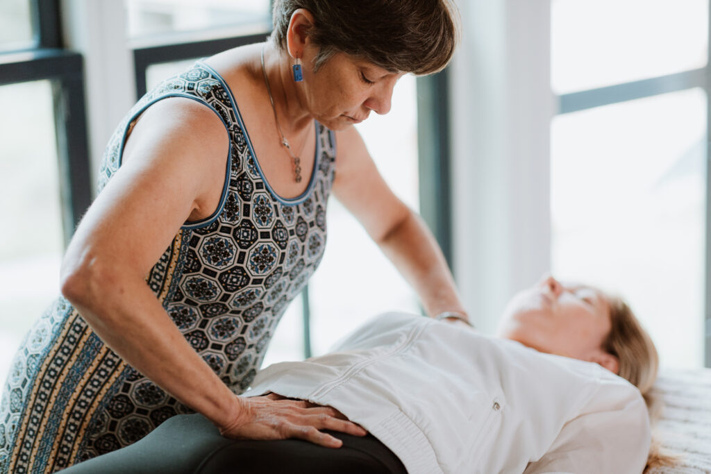 pelvic therapist and healer working with a patient