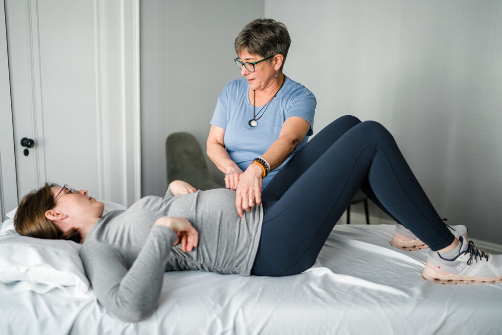 pelvic therapist working with an expectant mom