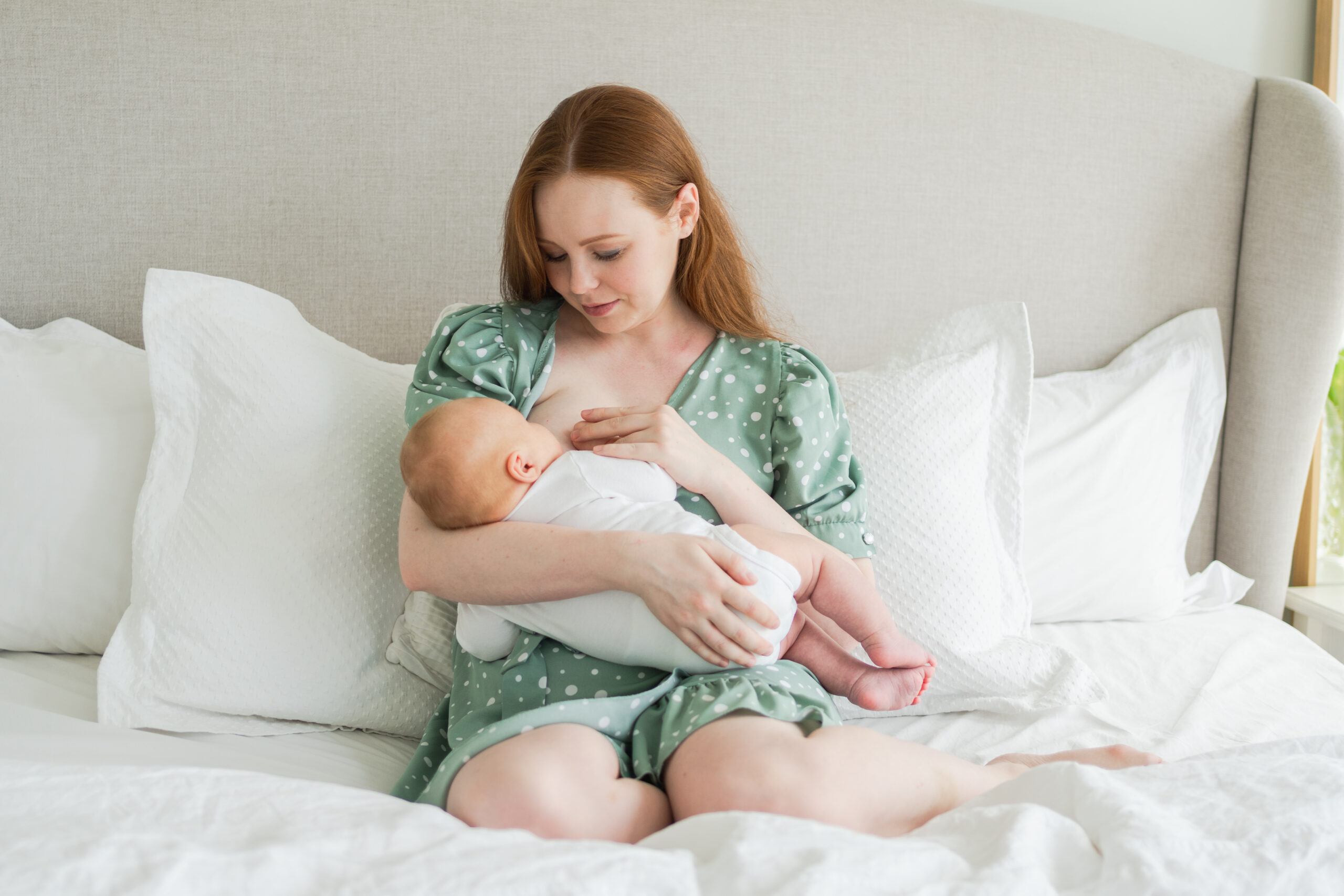 happy mother postpartum holding baby with pelvic organ prolapse